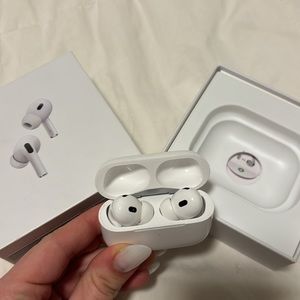 Apple AirPods Pro 2nd Generation box, unopened charger, and unopened ear tips
